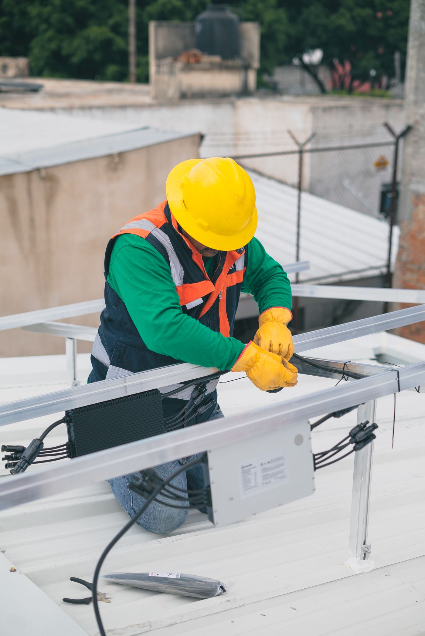 Tradesman installing racking on a roof